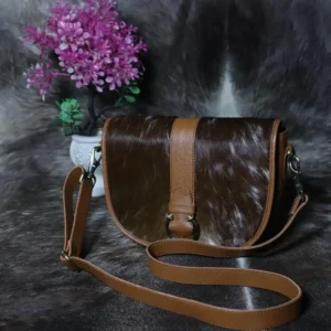 Cowhide buckle crossbody bag with flap closure in genuine leather
